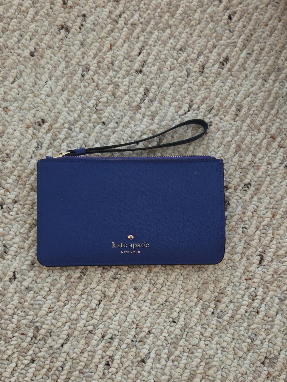 kate spade navy blue zip wristlet with gold logo